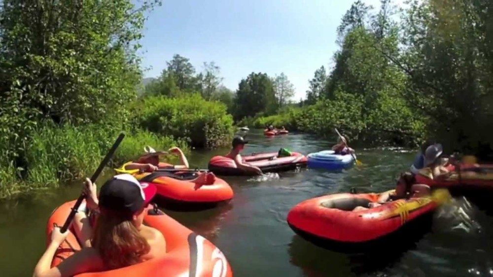 people floating down a river of rafts