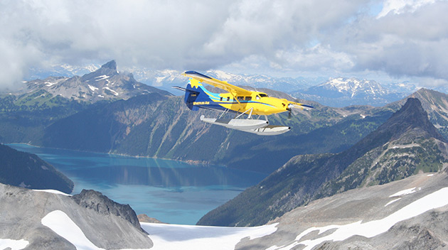 Float plane over glacier and mountains