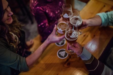 People celebrating with beer at Coast mountain