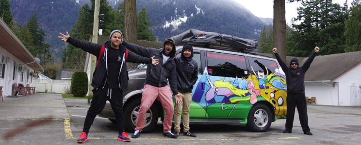 People standing in front of a rental camper van