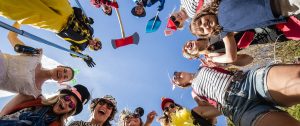 Kids smiling in a circle.