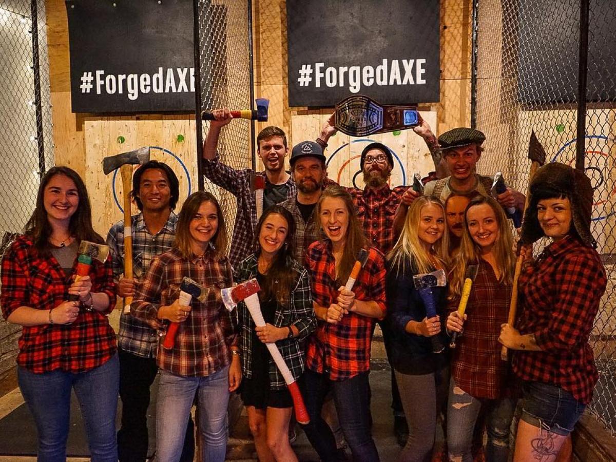 A group enjoying some axe throwing at forged axe in plaid in Whistler, CA