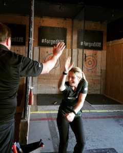 High five after winning axe throwing