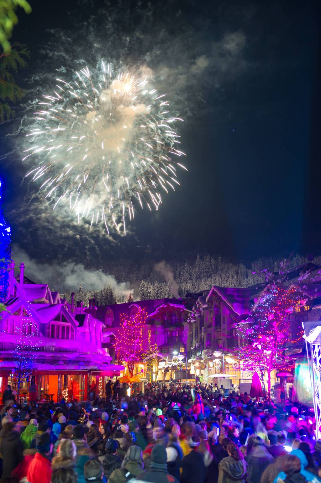 fireworks above a crowd of people in Whistler for NYE