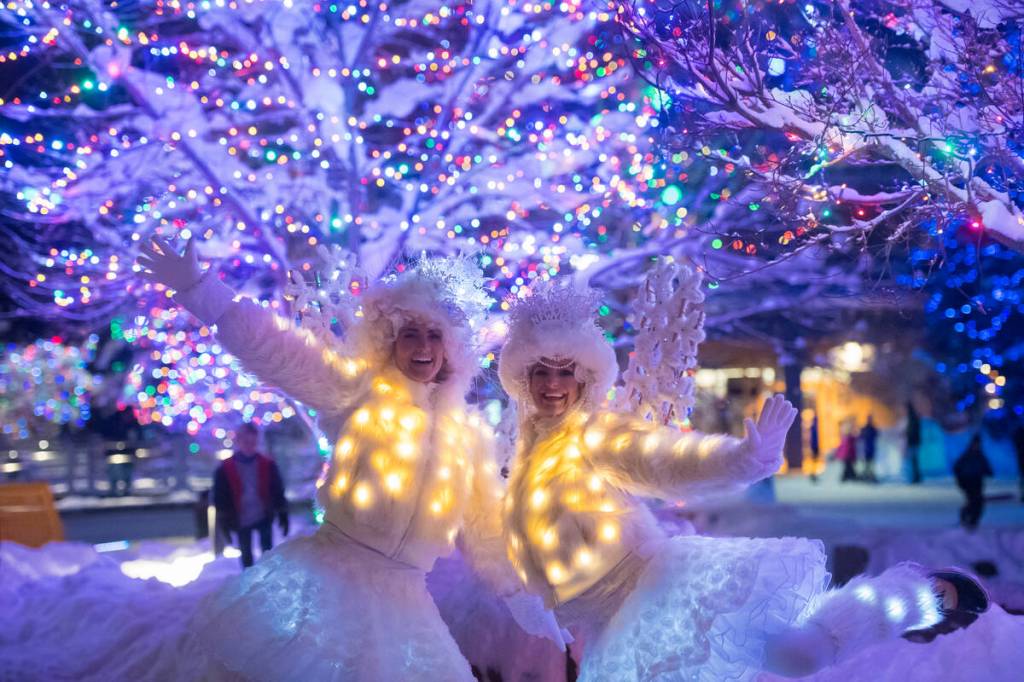 two clowns in white, skating at new year's eve in Whistler
