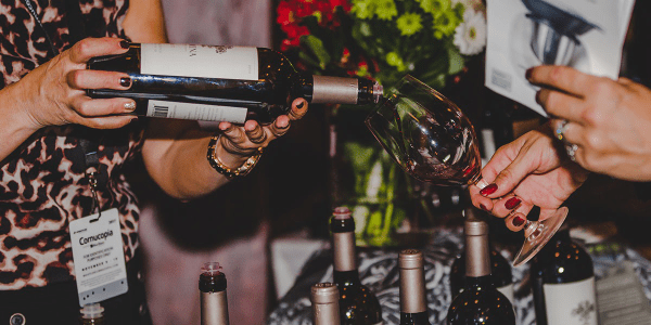 Woman pouring wine at an event
