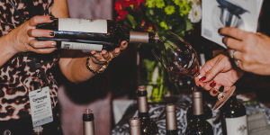 Woman pouring wine at an event