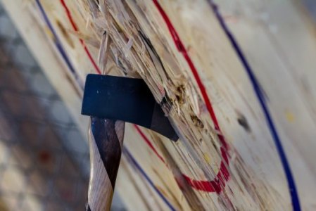 Axe head buried into a target at BATL