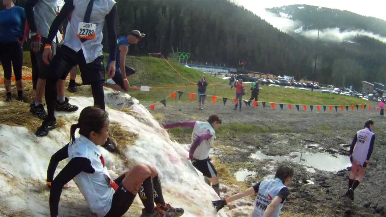 participants slide down an obstacle