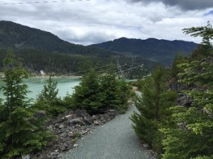 Gravel valley trail next to lake