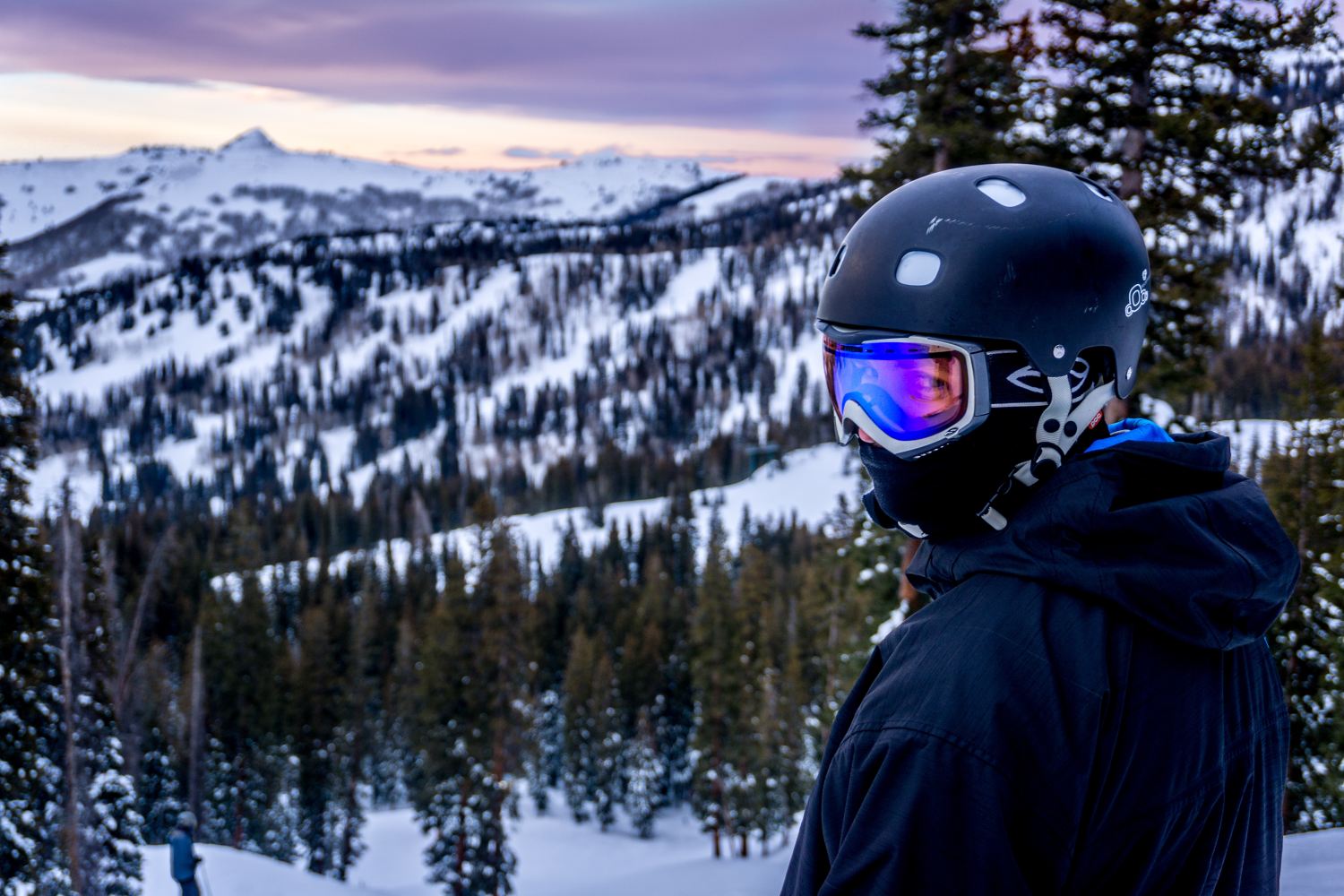 Woman wearing helmet, snowboarding