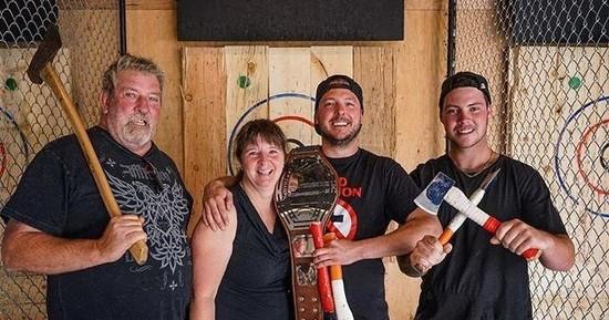 A group of friends holding axes