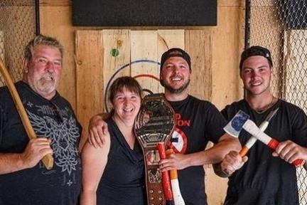 A group of friends holding axes