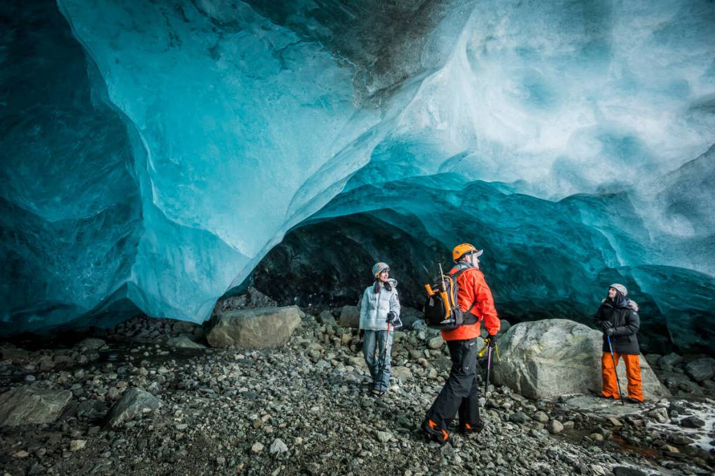 a group of people in a rocky area, whistler ice caves