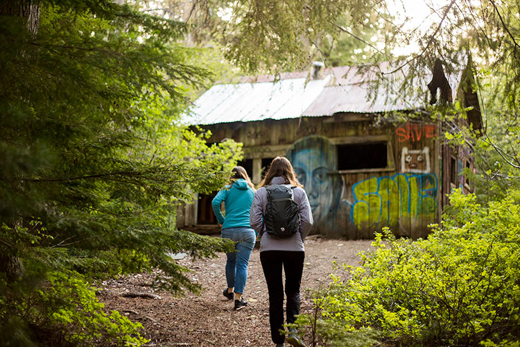 Two people hiking to Parkhusrt ghost town in Whistler