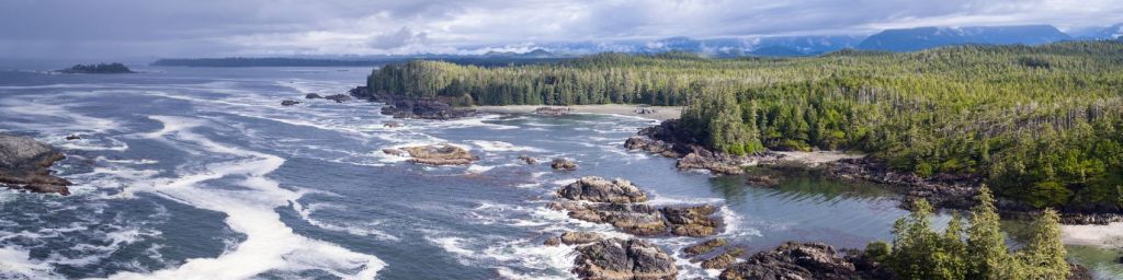 a body of water with a mountain in the background, vancouver Island